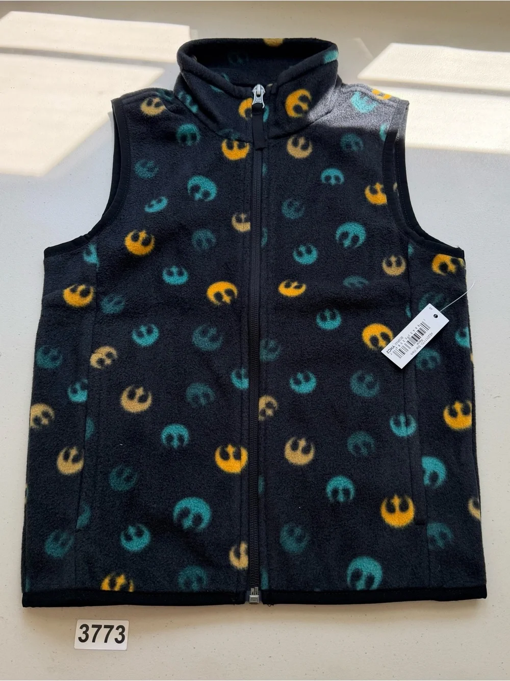 Sleeveless fleece vest featuring repeated Rebel Alliance emblems. Black base wit